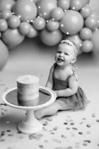 one-year smash cake, cake smash photographer Cave Springs, Bentonville cake smash photography, baby birthday portrait session NW Arkansas